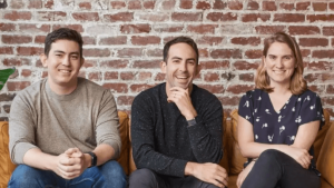 Hex technology founders seated together on a couch and smiling